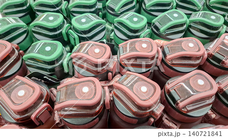 Top down view of pink and green plastic sports bottles 140721841