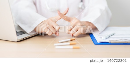 doctor hand making stop sign to refuse and breaking cigarette, quitting smoking for healthy lungs, prevent Lung Cancer and Emphysema, World No Tobacco Day concept 140722201