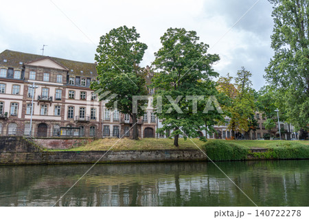 Riverside buildings and trees along the Ill river Strasbourg, France Riverside buildings and trees along the Ill river Strasbourg, France 140722278