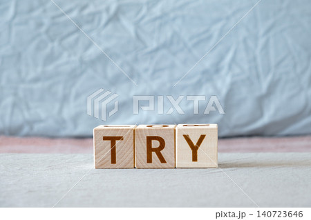 try, motivational word made of letters on wooden cubes 140723646