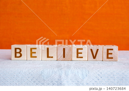 believe, motivational word made of letters on wooden cubes 140723684