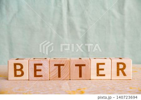better, motivational word made of letters on wooden cubes better, motivational word made of letters on wooden cubes 140723694