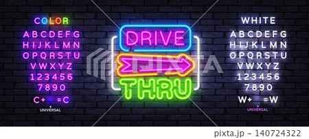 Editable Drive Thru neon sign with colorful alphabet and arrow on brick wall. Retro fast food template for takeaway cafe, diner branding and roadside advertising. 140724322
