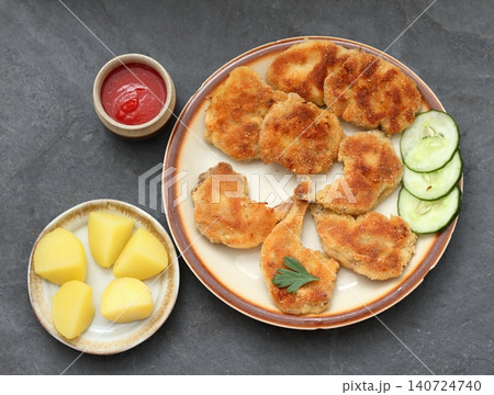 Quail schnitzel from legs and breasts on the plate. Quail schnitzel from legs and breasts on the plate. 140724740