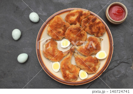 Quail schnitzel from legs and breasts and quail eggs on the plate Quail schnitzel from legs and breasts and quail eggs on the plate 140724741