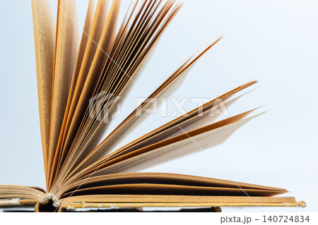 Open old book with text on white background. The concept of reading literature, education and book publishing. Free space for text Open old book with text on white background. The concept of reading literature, education and book publishing. Free space for text 140724834