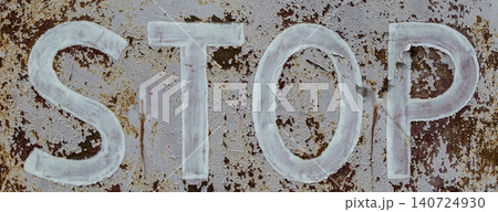 Rusty stop sign highlights urban decay and neglect in an abandoned area Rusty stop sign highlights urban decay and neglect in an abandoned area 140724930