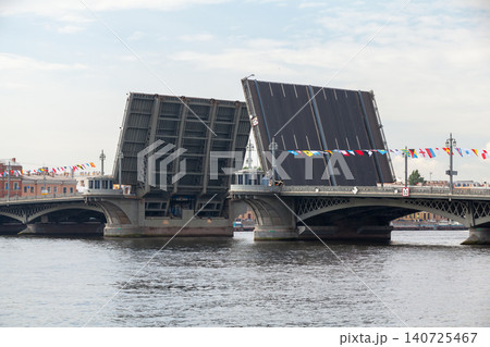 A large drawbridge lifts its spans over Neva river. St-Petersburg A large drawbridge lifts its spans over Neva river. St-Petersburg 140725467
