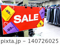 Sale banner stand at the clothing boutique with sale information. Promotion, advertising, shopping and black friday 140726025