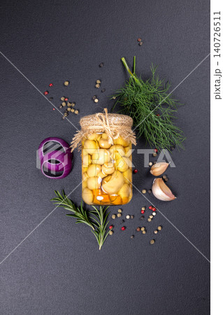 Pickled mushrooms preserving with fresh herbs and spices Pickled mushrooms preserving with fresh herbs and spices 140726511