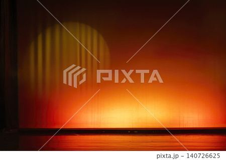 Empty stage illuminated by warm orange spotlight Empty stage illuminated by warm orange spotlight 140726625
