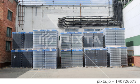 Pallets of beer bottles are awaiting shipment at the beer factory. Pallets of beer bottles are awaiting shipment at the beer factory. 140726675