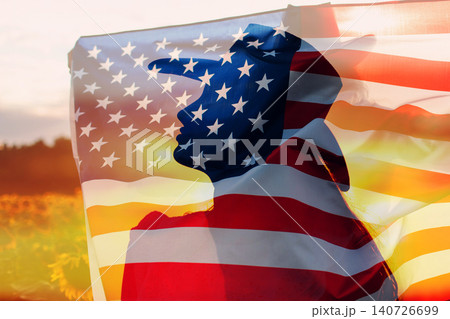 Woman in cowboy hat silhouette with the American Flag inside her head. 4th July celebration concept. Woman in cowboy hat silhouette with the American Flag inside her head. 4th July celebration concept. 140726699