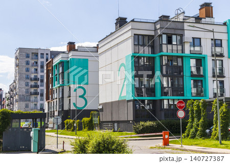 MINSK, BELARUS - JUNE 4, 2026: Modern apartment buildings with colorful facades in the Novaya Borovaya residential district 140727387