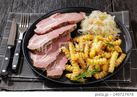 pork neck slices with sour cabbage, french fries pork neck slices with sour cabbage, french fries 140727478