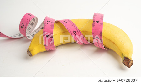 Male stands holding a banana, penis health. Male stands holding a banana, penis health. 140728887