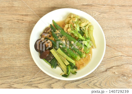 stir fried cauliflower and roselle with cabbage topping black mushroom in gravy garlic soy sauce on plate stir fried cauliflower and roselle with cabbage topping black mushroom in gravy garlic soy sauce on plate 140729239