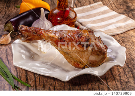 Savory roasted turkey drumstick with fresh vegetables and herbs Savory roasted turkey drumstick with fresh vegetables and herbs 140729909