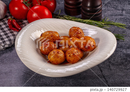 Roasted baby potatoes with herbs and spices in white bowl Roasted baby potatoes with herbs and spices in white bowl 140729927