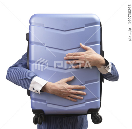 Businessman holding large suitcase in hands isolated white background business trip concept. Person carries luggage preparing for work journey. Concept of corporate travel professional Businessman holding large suitcase in hands isolated white background business trip concept. Person carries luggage preparing for work journey. Concept of corporate travel professional 140730268