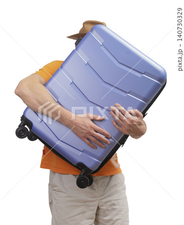 Man holding suitcase close to body isolated white background travel theme. Person carries luggage in hands preparing for journey. Concept of tourism vacation departure.. 140730329