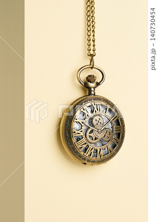 Antique pocket watch on a simple background. 140730454