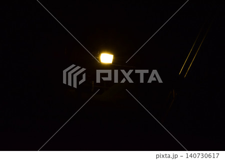 Set of professional stage lighting equipment on the stage for gig illumination of theater or concert hall. Stage lights, spotlights and laser beams. Rays of light from the floodlights. Concert light. 140730617