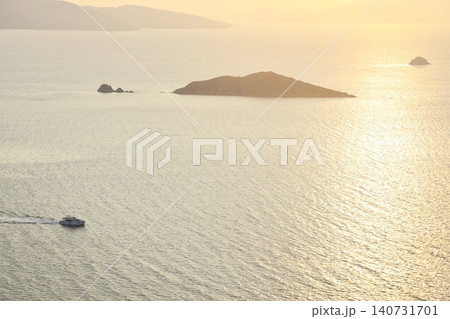 Seaside town of Turgutreis and spectacular sunsets. aerial view of islands and sea Seaside town of Turgutreis and spectacular sunsets. aerial view of islands and sea 140731701