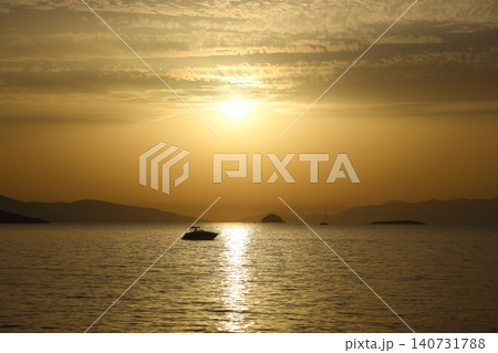 sunset on the beach. Seaside town of Turgutreis and spectacular sunsets. Selective Focus. sunset on the beach. Seaside town of Turgutreis and spectacular sunsets. Selective Focus. 140731788