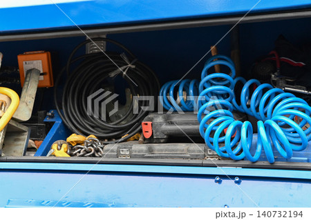 Tools and equipment in storage compartment Tools and equipment in storage compartment 140732194
