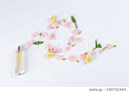 Flat lay composition with bottle of perfume on white background Flat lay composition with bottle of perfume on white background 140732444
