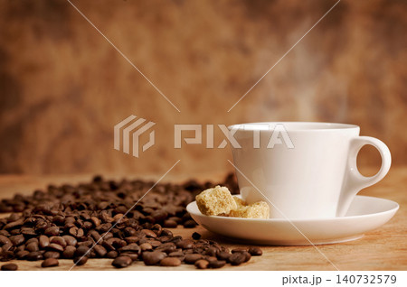 cup of coffee on brown background cup of coffee on brown background 140732579