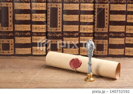 Notary's public pen and sealed document on wooden table Notary's public pen and sealed document on wooden table 140732592