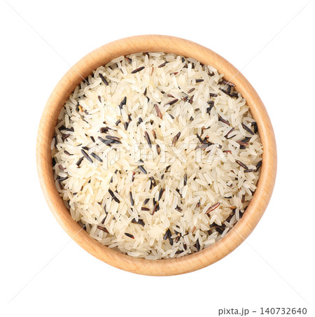 Mix of brown and polished rice in wooden bowl isolated on white, top view Mix of brown and polished rice in wooden bowl isolated on white, top view 140732640
