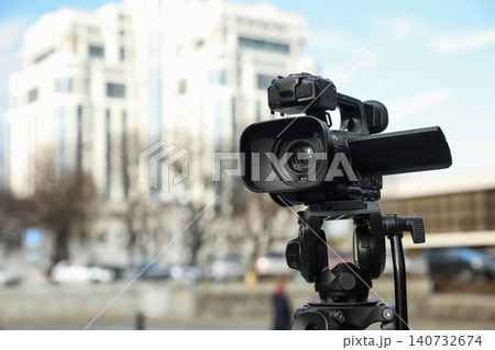 Professional video camera outdoors. Space for text 140732674