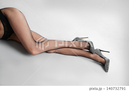 Woman wearing black tights and stylish shoes on light grey background, closeup of legs 140732791