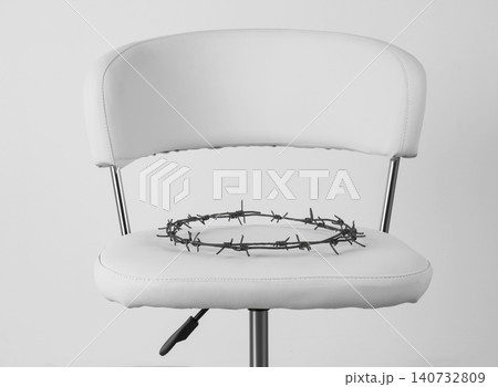Chair with barbed wire on white background. Hemorrhoids concept 140732809