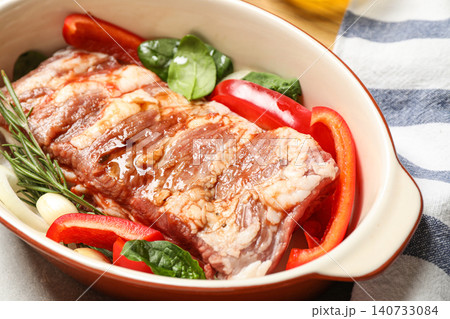 Raw spare ribs with garnish, closeup view Raw spare ribs with garnish, closeup view 140733084