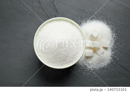Flat lay composition with granulated sugar on dark table Flat lay composition with granulated sugar on dark table 140733101