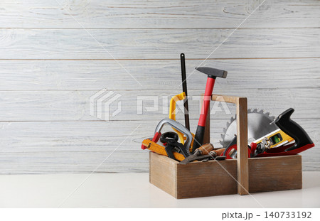 Box with carpenter's tools on white table. Space for text Box with carpenter's tools on white table. Space for text 140733192