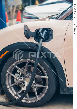 Electric car charging station. Hybrid car Electric charger station in the Car Park. Electric car charging station. Hybrid car Electric charger station in the Car Park. 140733541