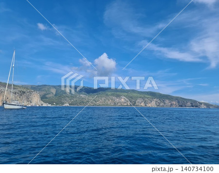 Vessel at a bay, enjoying the scenic views of the coastline Vessel at a bay, enjoying the scenic views of the coastline 140734100