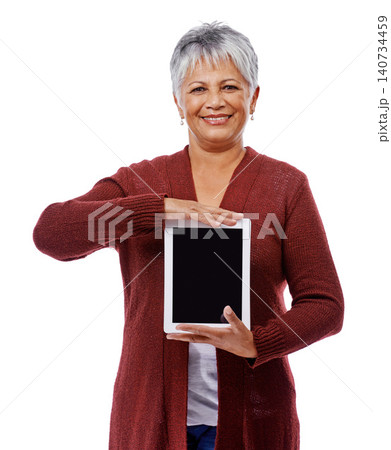 Portrait, mature woman and tablet with screen, smile and model isolated on a white studio background. Face, pensioner and senior lady with tech, promotion or mockup space with opportunity and showing Portrait, mature woman and tablet with screen, smile and model isolated on a white studio background. Face, pensioner and senior lady with tech, promotion or mockup space with opportunity and showing 140734459