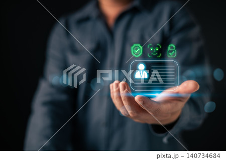 Businessman hand holding virtual digital ID card with face recognition. Concept of personal data information protection, cyber security, and secure biometric verification access technology. Businessman hand holding virtual digital ID card with face recognition. Concept of personal data information protection, cyber security, and secure biometric verification access technology. 140734684