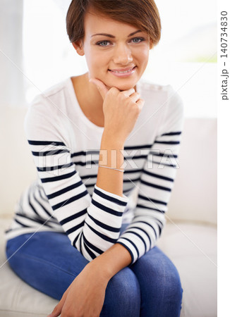 Home, fashion and portrait of happy woman to relax on sofa in lounge on vacation or holiday. Calm, break and girl with smile in casual clothes or pride for style in apartment on couch in living room 140734830