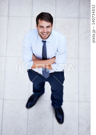 Business, portrait and high angle of man with arms crossed in office with confidence and pride. Above, entrepreneur and person in lobby to start morning in corporate London workplace with perspective 140734832