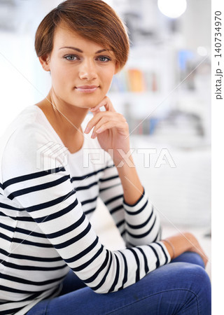 Home, fashion and portrait of woman to relax on sofa in lounge planning a vacation or holiday. Calm, break and girl n casual clothes or style in apartment on couch in living room with confidence Home, fashion and portrait of woman to relax on sofa in lounge planning a vacation or holiday. Calm, break and girl n casual clothes or style in apartment on couch in living room with confidence 140734970