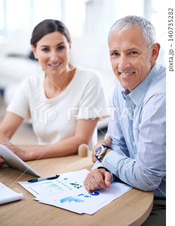 Smile, portrait and teamwork in meeting with documents, data and graph for corporate career. Worker, group or employees together for business discussion in office, workspace or conference room 140735282