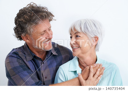 Old couple, smile with happiness and love in studio, hug and security with comfort for bonding. Marriage partner, retirement and connection with people for trust and loyalty on white background Old couple, smile with happiness and love in studio, hug and security with comfort for bonding. Marriage partner, retirement and connection with people for trust and loyalty on white background 140735404
