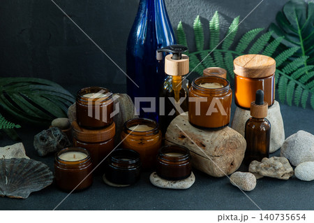 Amber Candles Glass Jars and Bottles Natural still life Amber Candles Glass Jars and Bottles Natural still life 140735654